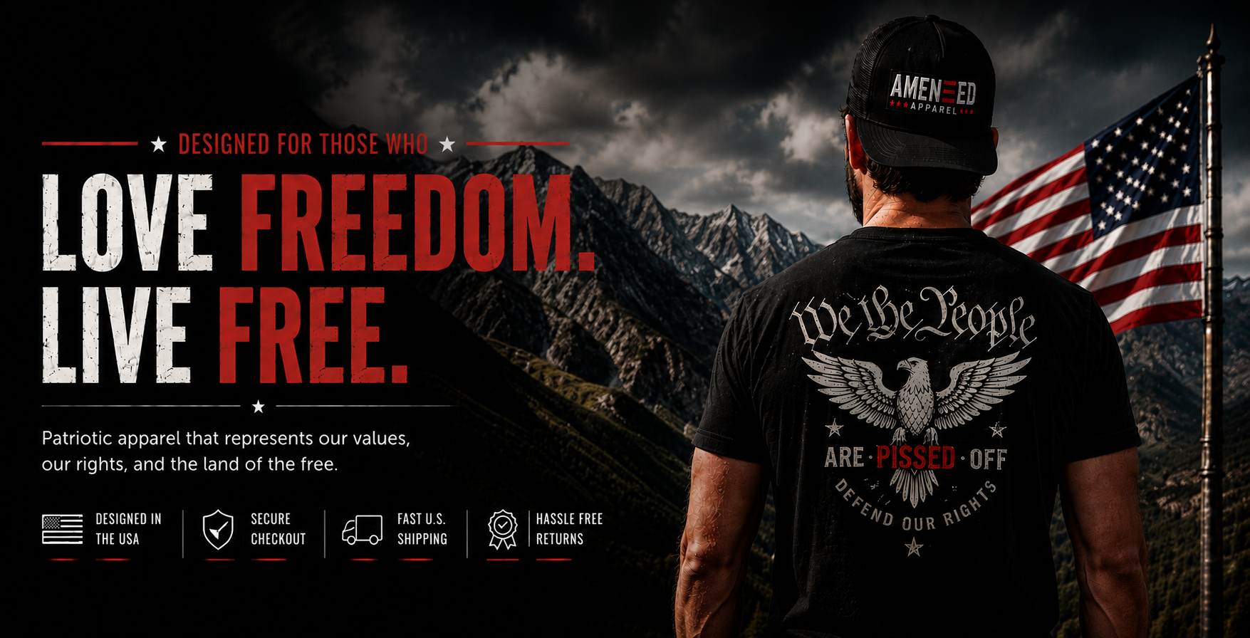 Man wearing a t-shirt with an eagle design and 'We The People' text, standing in front of mountains and an American flag.